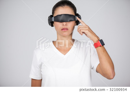 Woman using virtual video glasses 32100934