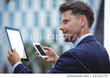 Businessman using digital tablet 32101178