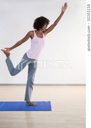 Woman performing yoga Woman performing yoga 32101216