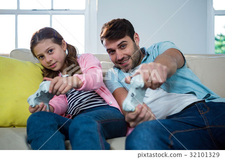 Father and daughter playing video game 32101329