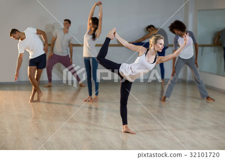 Woman performing stretching exercise 32101720