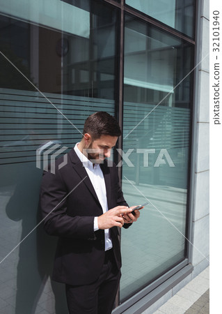 Businessman using mobile phone Businessman using mobile phone 32101940