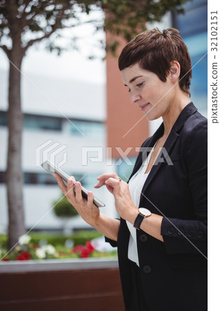 Businesswoman using digital tablet Businesswoman using digital tablet 32102151