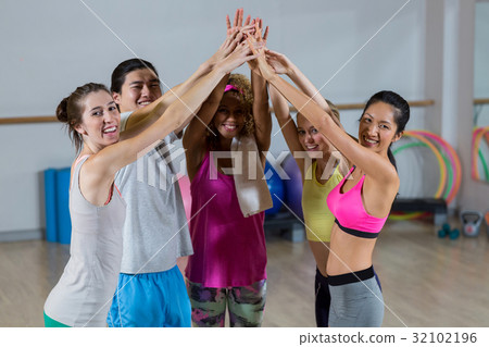 Group of fitness team with hand stacked 32102196