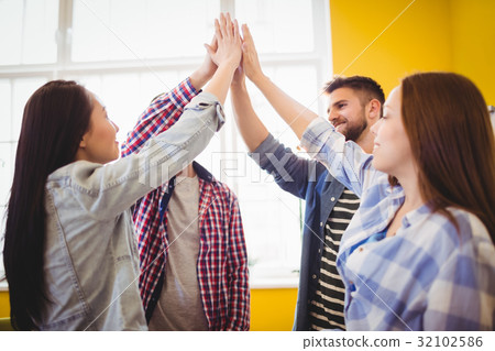 Graphic team giving high-five 32102586