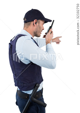 Security officer talking on walkie-talkie Security officer talking on walkie-talkie 32102750
