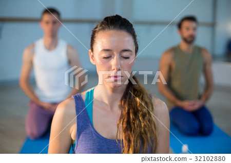 Beautiful woman performing yoga 32102880