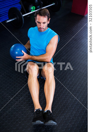 High angle view of male athlete holding ball High angle view of male athlete holding ball 32103505