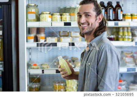 Portrait of happy man shopping for groceries Portrait of happy man shopping for groceries 32103695