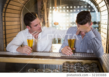 Man comforting his depressed friend Man comforting his depressed friend 32103888