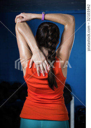 Rear view of female athlete in gym Rear view of female athlete in gym 32103942