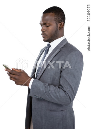 Businessman using his mobile phone Businessman using his mobile phone 32104073