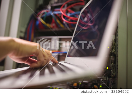 Technician working on laptop 32104962