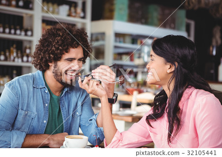 Happy couple eating dessert 32105441