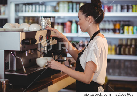 Smiling waitress making cup of coffee 32105663