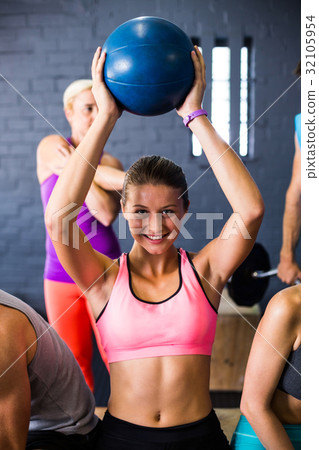 Pretty woman exercising with fitness ball Pretty woman exercising with fitness ball 32105954