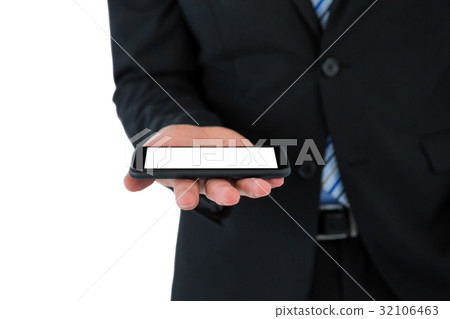 Mid section of businessman holding mobile phone 32106463