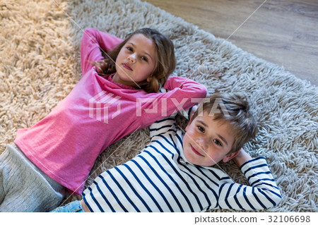 Children lying on the floor Children lying on the floor 32106698