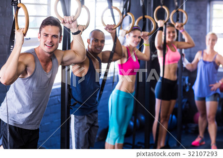 Portrait of smiling people with gymnastic rings 32107293