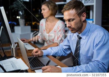 Businessman working on laptop 32107355