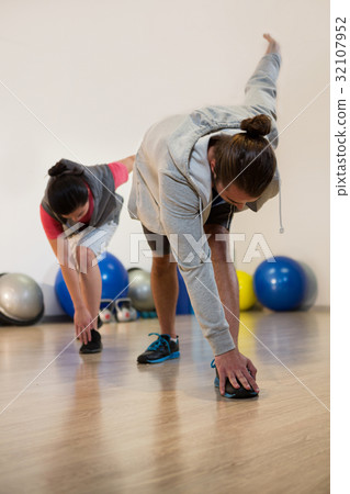 Men performing stretching exercise Men performing stretching exercise 32107952