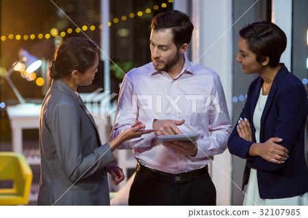 Businesspeople using digital tablet 32107985