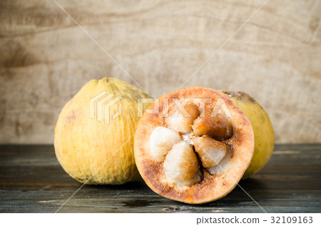 Ripe santol fruit on wooden background Ripe santol fruit on wooden background 32109163