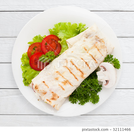 Shawarma. Sandwich wrap of pita bread on plate 32111466