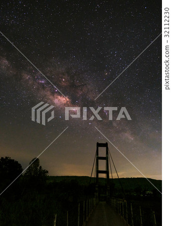 Milky way over rope bridge 32112230