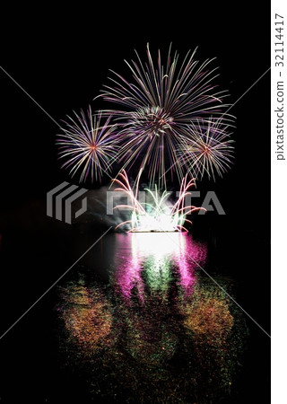 Firework.Beautiful colorful fireworks on the water Firework.Beautiful colorful fireworks on the water 32114417