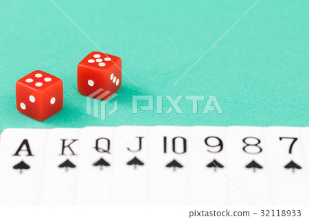 Dices and cards on green casino table 32118933
