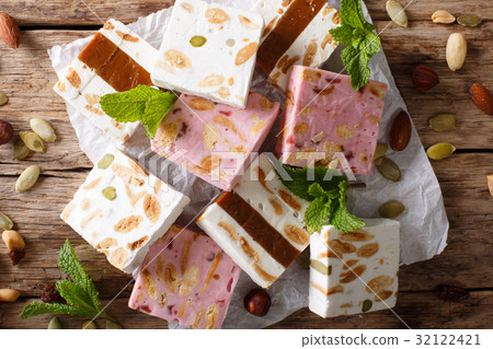French fresh nougat with nuts and pumpkin seeds French fresh nougat with nuts and pumpkin seeds 32122421