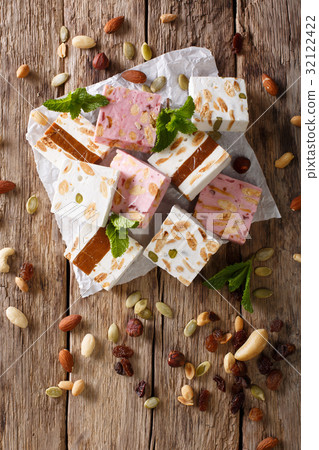 Sweet nougat with nuts, decorated with mint 32122422