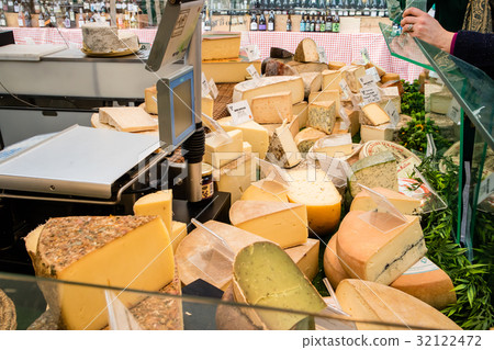 French cheese specialties on a stall market French cheese specialties on a stall market 32122472