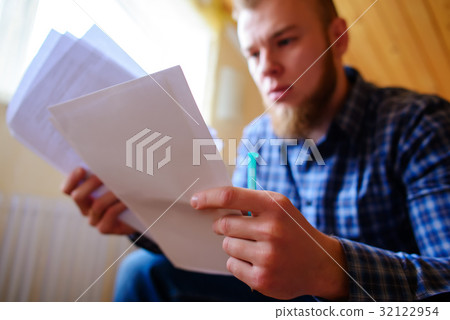 Young handsome man sitting on the couch  32122954