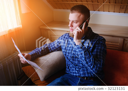 Serious mature man holding paper Serious mature man holding paper 32123131