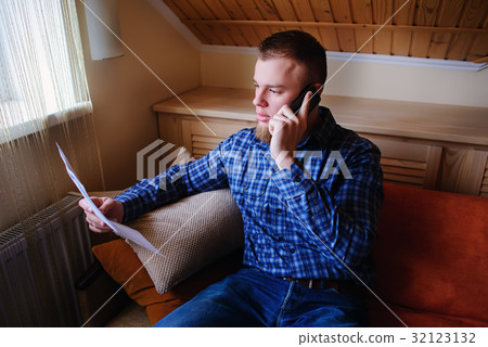 Serious mature man holding paper Serious mature man holding paper 32123132