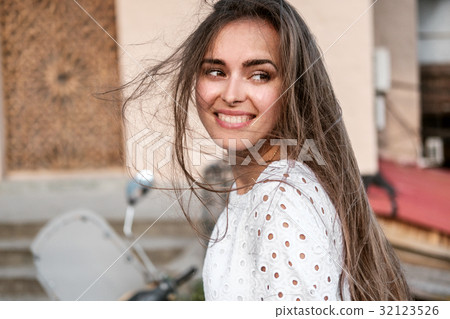 Street portrait of a beautiful brunette girl Street portrait of a beautiful brunette girl 32123526