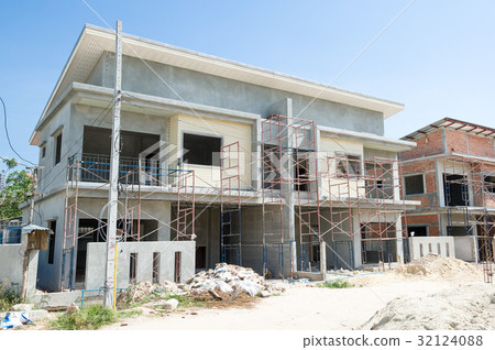 building in construction site with scaffolding 32124088