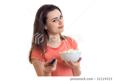 Portrait of a pretty girl with remote control in Portrait of a pretty girl with remote control in 32124523