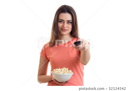 happy young girl switches remote control and happy young girl switches remote control and 32124542