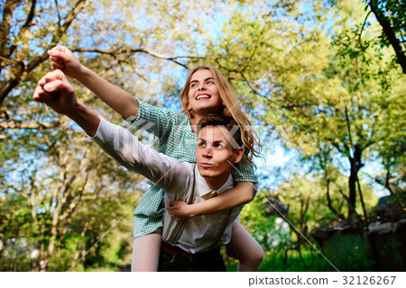 couple raising their hands in open air 32126267