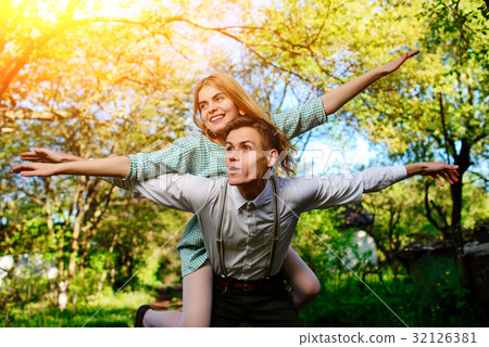 couple raising their hands in open air couple raising their hands in open air 32126381