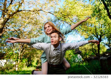 couple raising their hands in open air 32126383