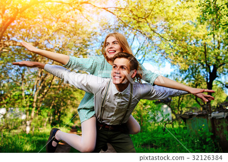 couple raising their hands in open air 32126384