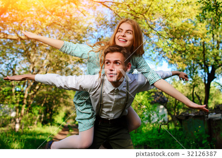 couple raising their hands in open air 32126387