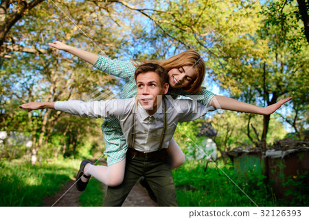 couple raising their hands in open air 32126393