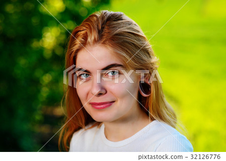 beautiful woman with wooden tunnels in her ears beautiful woman with wooden tunnels in her ears 32126776