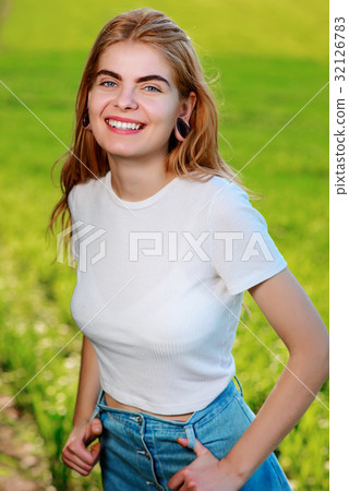beautiful woman with wooden tunnels in her ears beautiful woman with wooden tunnels in her ears 32126783