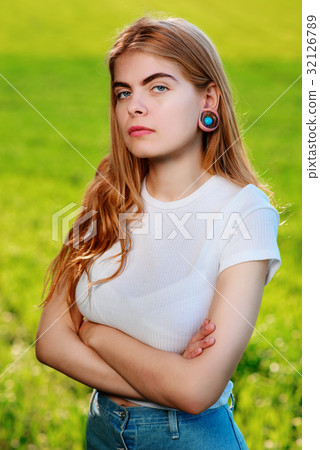 beautiful woman with wooden tunnels in her ears beautiful woman with wooden tunnels in her ears 32126789
